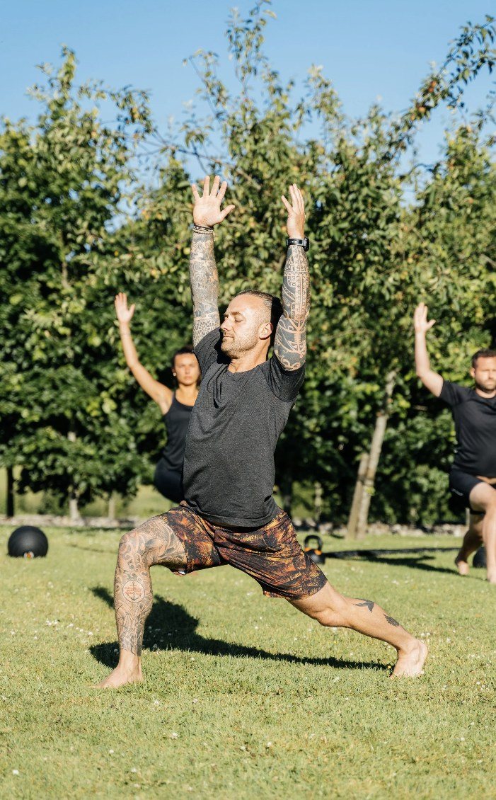 Outdoor yoga session on a lawn